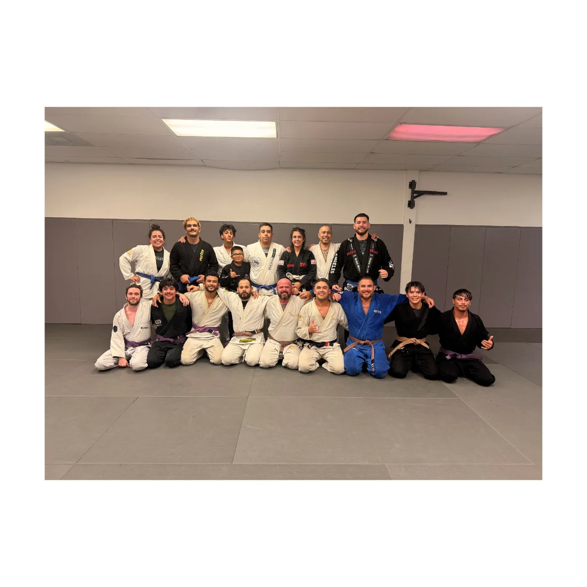Adult jiu-jitsu class drilling gi technique at Kulture BJJ in Riverside